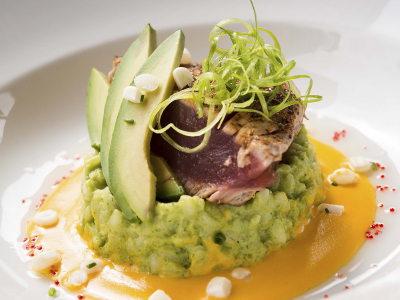 plated dish of seared tuna and slices of avocado